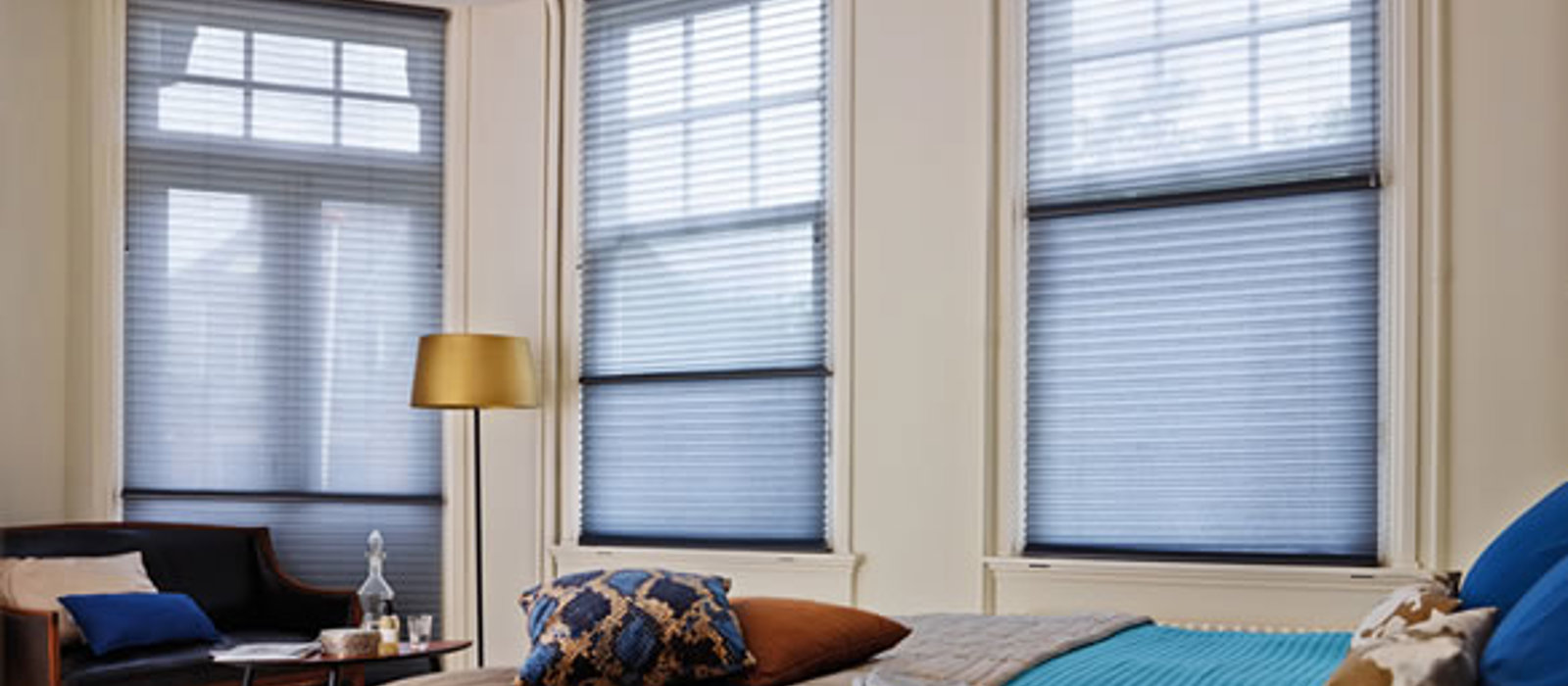 Elegant blue bedroom with blue Duette energy saving blinds