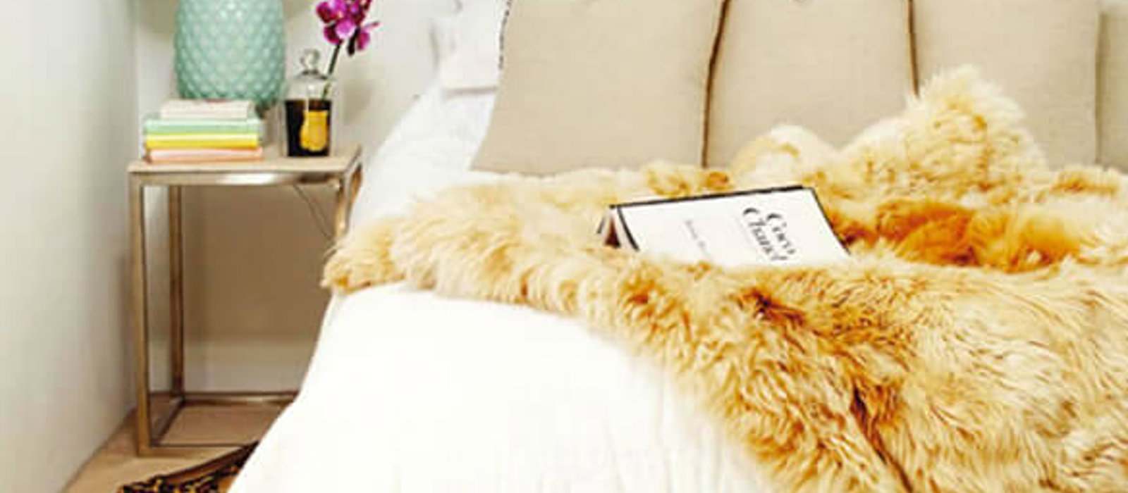 Cosy bedroom with faux fur throw