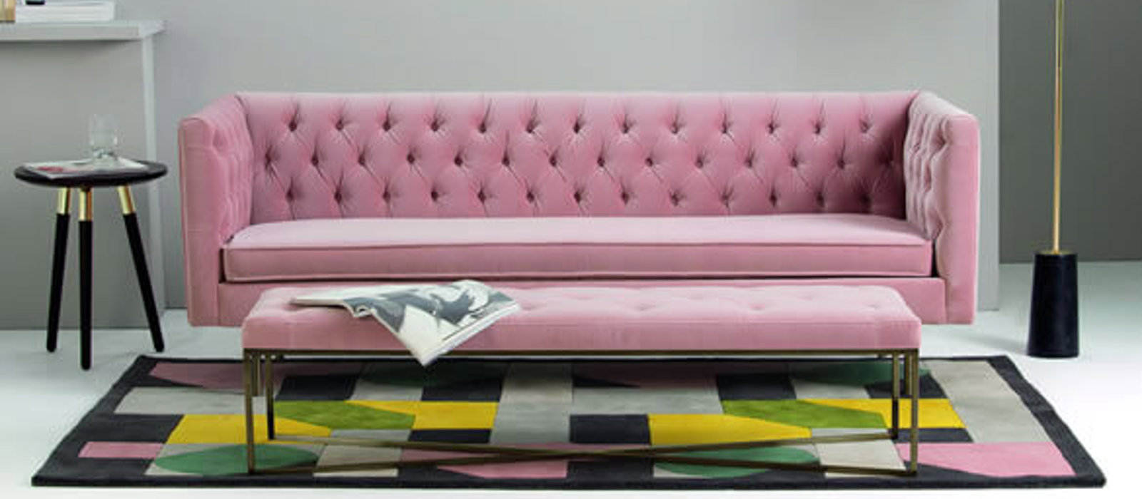 Pink statement sofa in a living room