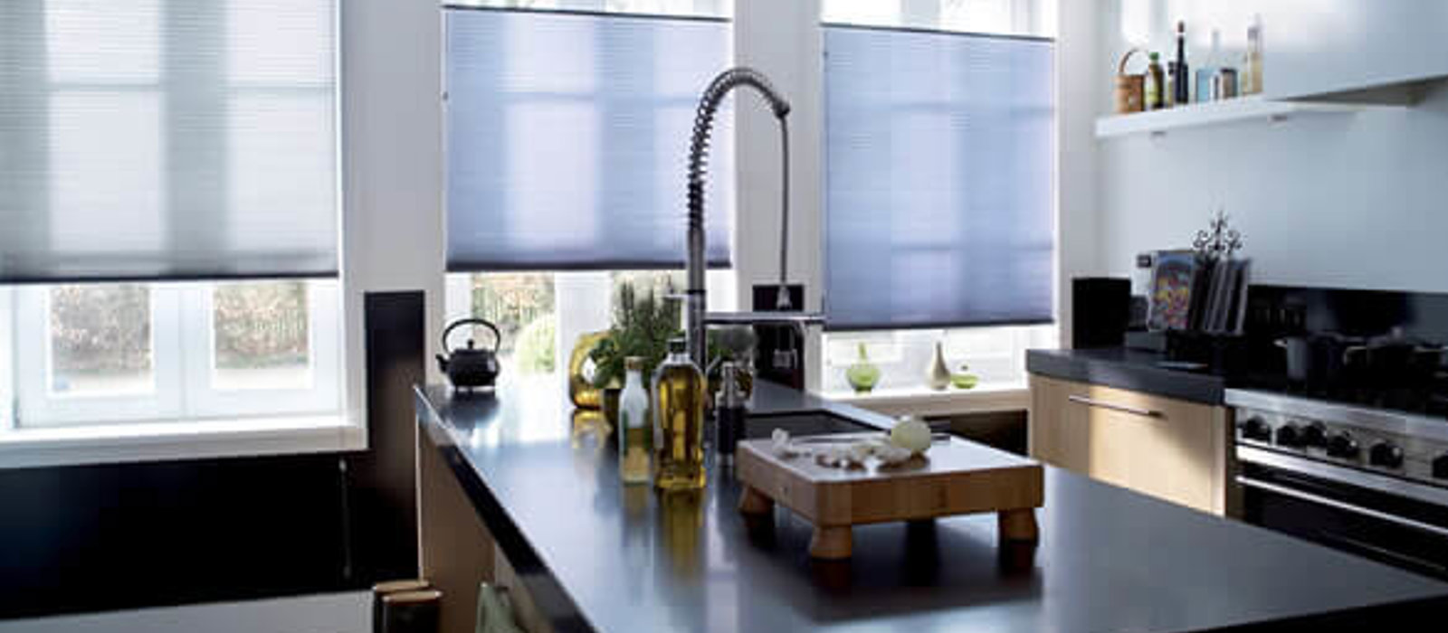 Modern kitchen with blue Duette energy saving blinds