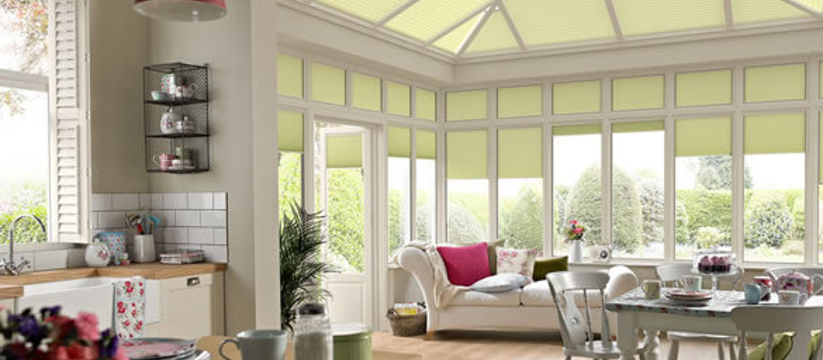 Traditional living space with large conservatory fitted with Duette roof blinds to keep the heat out