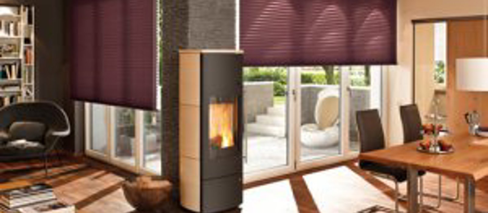 Cosy open plan kitchen and living area with windows fitted with warm berry coloured Duette blinds